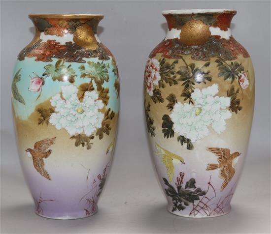 A pair of Japanese Kutani floral decorated vases 30cm.